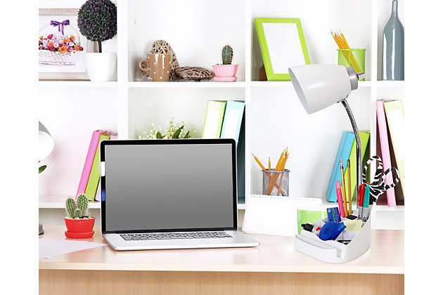 Style and functionality meet with this fun organizer desk lamp with iPad stand and charging outlet. It is beautifully finished and comes equipped to hold many of the important essentials needed in a desk organizer. The flexible chrome gooseneck allows you to point the light exactly where you need it. ON/OFF rotary switch is located on the head for convenience.  Organizer includes 8 compartments for storing pens, pencils, paper clips, etc. It also has a spot to rest your iPad, book, or notebook for easy viewing and a convenient 2 prong electric outlet for charging the device you are using, or electronics nearby!Plastic head and base with organizer and rotary switch on head of shade | Chrome gooseneck that allows you to point the light in any direction | Organizer includes 8 compartments for storing supplies and stand for ipad or book easy viewing | Features a 2 prong outlet on base for charging your phone or other device