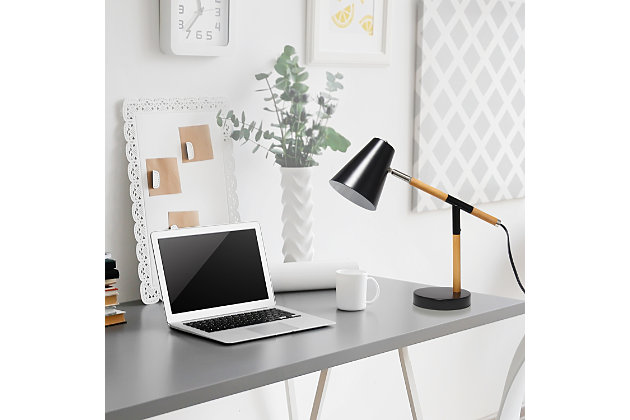 Simple yet modern this desk lamp will add a stylish touch to your home, dorm or office!  The conical shade can be easily adjusted 180 degrees that allows easy focusing of light where needed the most. Made of mixed materials, this lamp is on trend!Matte black base with  wood accents | Metal shade | Easily accessible rotary switch located on the cord | Uses 1 x 40w medium type a base bulb (not included)
