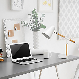 Simple yet modern this desk lamp will add a stylish touch to your home, dorm or office!  The conical shade can be easily adjusted 180 degrees that allows easy focusing of light where needed the most. Made of mixed materials, this lamp is on trend!Matte white base with  wood accents | Metal shade | Easily accessible rotary switch located on the cord | Uses 1 x 40w medium type a base bulb (not included)