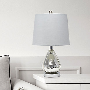 Enhance your room with this stylish chrome glass lamp.  The gray fabric shade is the perfect compliment to the base with its' lustrious finish and subtle ripple design.  Perfect for your living room, bedroom, office or anywhere you need to add a touch of sparkle!Fabric gray shade | Chrome glass base with subtle ripple design | 1 x 60w medium type a base bulb (not included) required | More shade color options available!