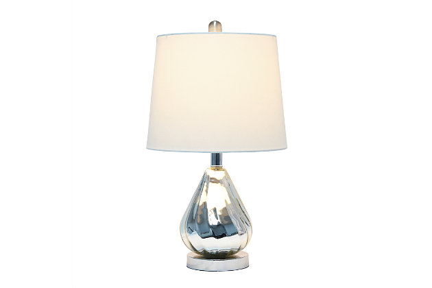 Enhance your room with this stylish chrome glass lamp.  The white fabric shade is the perfect compliment to the base with its' lustrious finish and subtle ripple design.  Perfect for your living room, bedroom, office or anywhere you need to add a touch of sparkle!Fabric white shade | Chrome glass base with subtle ripple design | 1 x 60w medium type a base bulb (not included) required | More shade color options available!