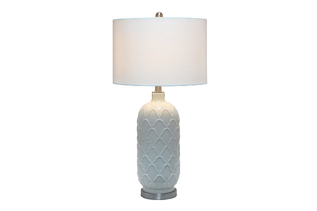 This simple yet sophisticated lamp stands tall at 29.25" and is sure to make a statement in any room in your home.  The crisp white glass is delicately designed with a charming pattern and complimented with brushed nickel accents and a fresh white fabric drum shade.   Perfect for large foyers, bedrooms, living rooms or offices!Fabric white shade | The white glass base is adorned with a beautiful, sophisticated design | 1 x 100w 3-way medium type a base bulb (not included) required | 5 foot clear cord
