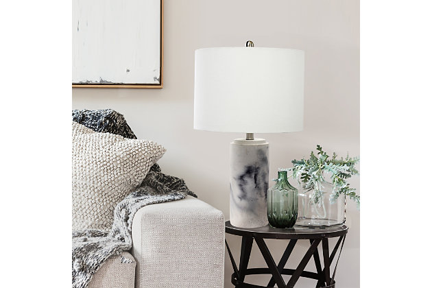 Brighten up any room in your home with this refined table lamp.  The base features a beautiful marble-effect finish complimented by a fresh white fabric drum shade.  Perfect for your living room, bedroom, office, or anywhere you need to add chic sophistication!Fabric white shade | Faux marble finish on base | 1 x 100w 3-way medium type a base bulb (not included) required | 5 foot clear cord