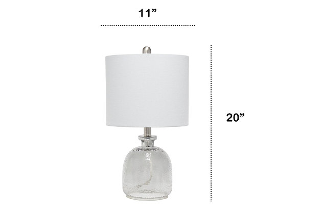 With a textured glass base and gray fabric drum shade, this lamp is sure to update any room in your home with a little charm.  This lovely lamp is crafted with an open bottom glass base in a transparent gray color. Perfect for adding the little refresh to your living room, bedroom, foyer or office that you've been looking for!Fabric gray shade | Transparent gray glass base | 1 x 60w medium type a base bulb (not included) required | More shade color options available!
