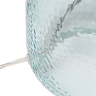 With a textured glass base and white fabric drum shade, this lamp is sure to update any room in your home with a little charm.  This lovely lamp is crafted with an open bottom glass base in a clear blue color. Perfect for adding the little refresh to your living room, bedroom, foyer or office that you've been looking for!Fabric white shade | Clear blue glass base | 1 x 60w medium type a base bulb (not included) required | More shade base color options available!