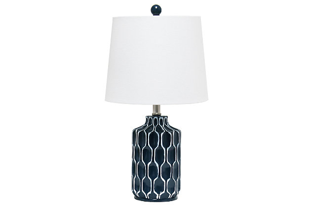 Enhance any room in your home with this contemporary table lamp.  The blue base features a simple yet stylish handpainted white design and is complimented by a white fabric shade.  Perfect for adding the little refresh to your living room, bedroom, foyer or office that you've been looking for!Fabric white shade | Handpainted white design on a blue resin base | 1 x 60w medium type a base bulb (not included) required | 5 foot clear cord
