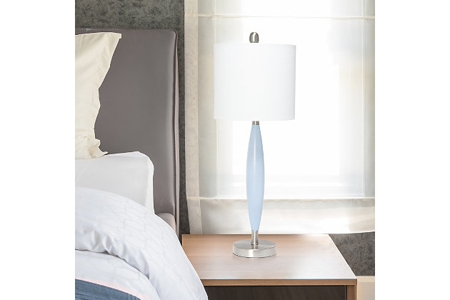 Illuminate your room in style with this simple, contemporary table lamp.  With a pop of blue color in the center, accented with brushed nickel and a white fabric drum shade, this lamp is sure to add a touch of sophistication to any room in your home!  Perfect for adding the little refresh to your living room, bedroom, foyer or office that you've been looking for!Fabric white drum shade | Blue and brushed nickel base | 1 x 60w medium type a base bulb (not included) required | 5 foot clear cord