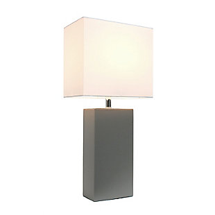 This fashionable table lamp, with its leather body and white fabric shade, will add style and pizzazz to any room. We believe that lighting is like jewelry for your home. Our products will help to enhance your room with elegance and sophistication.Leather wrapped base | White fabric shade | Modern and stylish look | Assembled dimensions: l: 10" x w: 6" x h: 21"