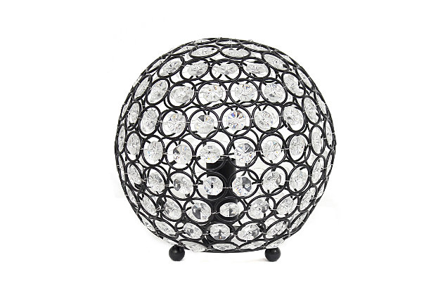 Make your room sparkle with a shining ball of crystals. The perfect addition to any bedroom, office, nursery, or even a foyer or entryway! We believe that lighting is like jewelry for your home. Our products will help to enhance your room with elegance and sophistication.Crystal ball shape glows from within casting pretty shadows | Threaded with steel rings and set on ball feet | Restoration bronze finish | Height: 8" diameter: 7.75"
