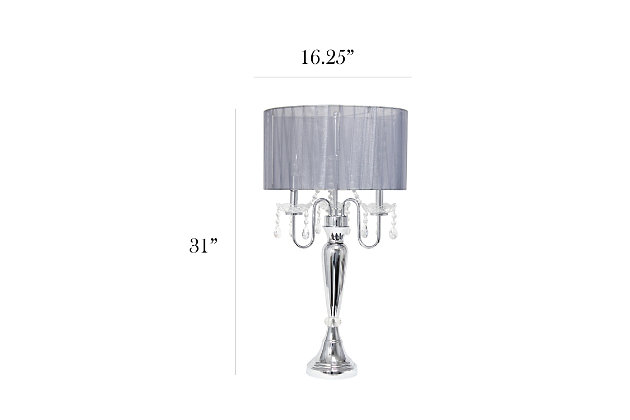 Crystal drop table lamp. A modern twist on a classic table lamp. Features a sheer shade, flawless chrome finish, and beautiful draping crystals. Great fit for any room! Use it in a bedroom to create a romantic atmosphere or in a living room or office to add some fresh decorative flair. We believe that lighting is like jewelry for your home. Our products will help to enhance your room with elegance and sophistication.Romantic pleated sheer shade | Flawless chrome finish | Beautiful draping crystals | Height: 27" shade diameter: 16.54"