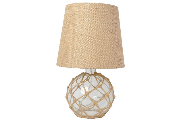 If you have that lovely beach house, condo, or rental you're looking to decorate, check out this nautical table lamp fitting for your coastal decor!  The clear glass base is netted in a natural rope, complemented by a burlap empire fabric shade.  This lamp is just over a foot tall making ideal to sit on your nightstand, dresser, in your living room, entry way, and just about any room in your home!Clear glass base wrapped in natural rope | Burlap empire fabric shade | Uses 1 x 60w type a medium base bulb (not included) | On/off switch located conveniently on the cord