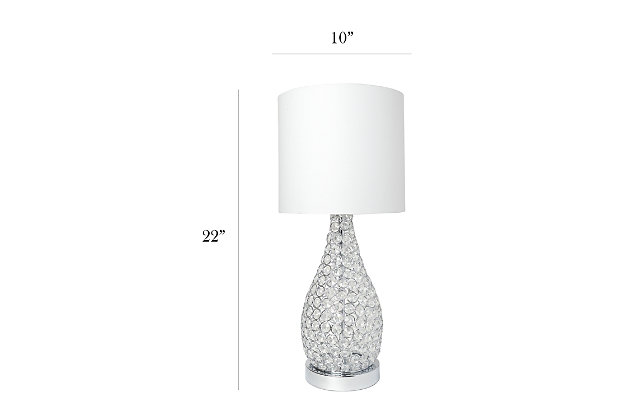 As part of Elegant Design's Elipse collection, this stunning crystal and chrome table lamp is designed to offer a feel of elegance and glamour to any room in your home and/or place of business. A cylinder of K5 crystals built on a solid raised chrome base casts a warm, sparkling glow during use of the lamp.  Like many of the other items in this collection, these pieces will upgrade your basic lamp to embody a more modern and contemporary feel to your decor.  Combine this lamp with any of the others in the Elipse collection for mix and matching pieces!Features a beautiful chrome base and details | Elegant k5 crystals throughout | Uses 1 x 40w type a medium base bulb (not included) | On/off switch located conveniently on the cord