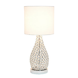 As part of Elegant Design's Elipse collection, this stunning crystal and chrome table lamp is designed to offer a feel of elegance and glamour to any room in your home and/or place of business. A cylinder of K5 crystals built on a solid raised chrome base casts a warm, sparkling glow during use of the lamp.  Like many of the other items in this collection, these pieces will upgrade your basic lamp to embody a more modern and contemporary feel to your decor.  Combine this lamp with any of the others in the Elipse collection for mix and matching pieces!Features a beautiful chrome base and details | Elegant k5 crystals throughout | Uses 1 x 40w type a medium base bulb (not included) | On/off switch located conveniently on the cord