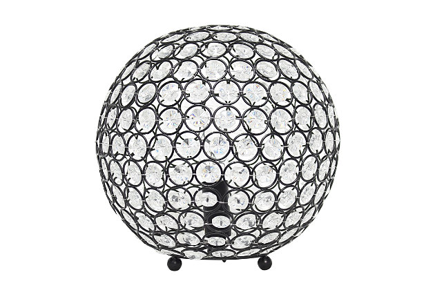 Make your room sparkle with a beautifully designed crystal ball shaped lamp. This 10" version is available in one of the many available finishes is the perfect addition to any bedroom, office, nursery, or even a foyer or entryway! We believe that lighting is like jewelry for your home. Our products will help to enhance your room with elegance and sophistication.Crystal ball shape glows from within casting pretty shadows | Threaded with steel rings and set on ball feet | Restoration bronze finish | Height: 10" diameter:10"