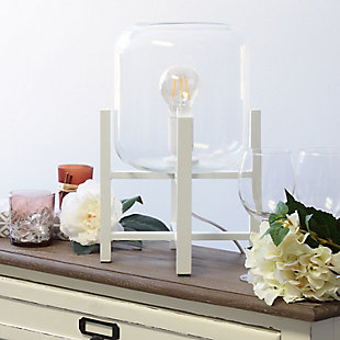 This contemporary lamp elevates the glass shade on a four-arm wood stand finished in white.  The curvy cylindrical clear glass shade combined with the geometric wood base creates the perfect ensemble.  Place on a desk, nightstand, dresser or table  for a modest, refined look in fashion lighting.
**HELPFUL TIP: To get the complete vintage look, we recommend using a decorative Edison/Vintage bulb (not included). **White wood base | Clear glass shade | Easily accessible on/off switch located on the cord | Uses 1 x 40w medium type a base bulb (not included).
For full vintage look, type t45 edison bulb is recommended