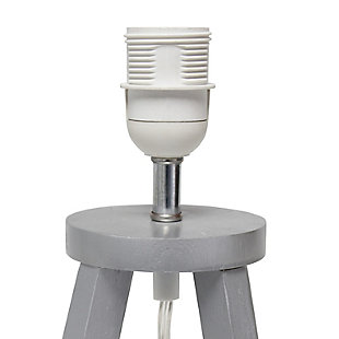 Add a touch of simplicity to your home with this contemporary lamp. The soft, white fabric shade compliments the geometric gray wood base for a clean, simple look.  Perfect lamp for a bedroom, living area, office, kid's room or college dorm.Gray wood base | White fabric shade | Easily accessible on/off switch located on the cord | Uses 1 x 40w medium type a base bulb (not included)