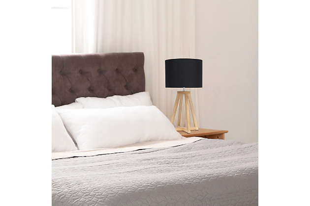 Add a touch of simplicity to your home with this contemporary lamp. The soft, black fabric shade compliments the geometric natural wood base for a clean, simple look.  Perfect lamp for a bedroom, living area, office, kid's room or college dorm.Natural wood base | Black fabric shade | Easily accessible on/off switch located on the cord | Uses 1 x 40w medium type a base bulb (not included)