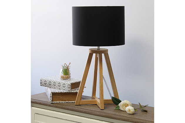 Add a touch of simplicity to your home with this contemporary lamp. The soft, black fabric shade compliments the geometric natural wood base for a clean, simple look.  Perfect lamp for a bedroom, living area, office, kid's room or college dorm.Natural wood base | Black fabric shade | Easily accessible on/off switch located on the cord | Uses 1 x 40w medium type a base bulb (not included)
