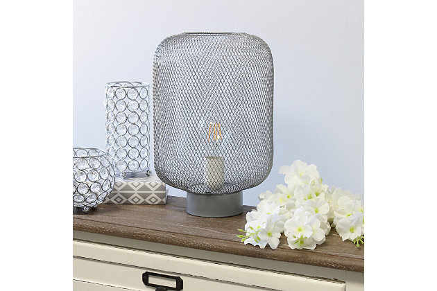 This metal table lamp with mesh shade will add ambiance and style to any room in your home!  With a simple, lattice cut out design this lamp illuminates beautifully.  Undoubtedly the perfect accent piece to your home, this industrial lamp will not disappoint! 

**HELPFUL TIP: To get the complete vintage look, we recommend using a decorative Edison/Vintage bulb (not included). **Gray metal base | Gray mesh metal shade | Easily accessible on/off switch located on the cord | Uses 1 x 40w medium type a base bulb (not included)

for full vintage look, type t45 edison bulb is recommended