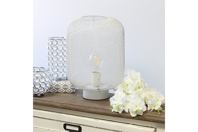 This metal table lamp with mesh shade will add ambiance and style to any room in your home!  With a simple, lattice cut out design this lamp illuminates beautifully.  Undoubtedly the perfect accent piece to your home, this industrial lamp will not disappoint! 

**HELPFUL TIP: To get the complete vintage look, we recommend using a decorative Edison/Vintage bulb (not included). **White metal base | White mesh metal shade | Easily accessible on/off switch located on the cord | Uses 1 x 40w medium type a base bulb (not included)

for full vintage look, type t45 edison bulb is recommended