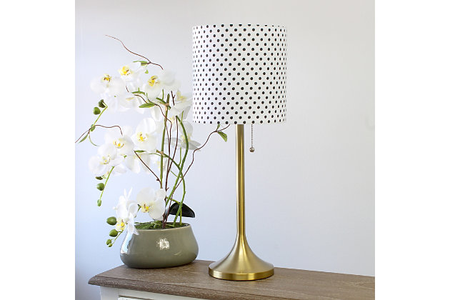 This fun and fashionable lamp features a gold metal base and polka dot fabric drum shade making it the perfect addition to your lighting needs. This lamp will add simplicity and style to any space in your home.  Perfect for bedrooms, kids and teens, college dorms, nurseries, or fun offices!Gold metal base | White with black polka dots fabric shade | Pull chain on/off switch | Uses 1 x 40w medium type a base bulb (not included)