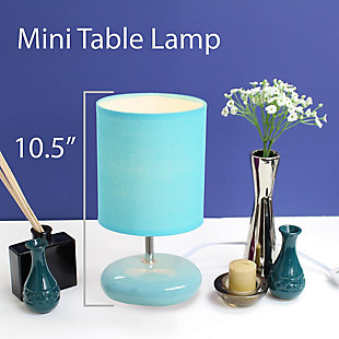 A fun, inexpensive, and practical table lamp to meet your basic fashion lighting needs. This small lamp features a stone shaped ceramic base and matching fabric shade. The compact size of this lamp makes it the perfect bedside counterpart.Small stone shaped ceramic base | Matching fabric shade | Perfect for bedroom, kids room, or college dorm | Height: 10.24" shade diameter: 5.5"