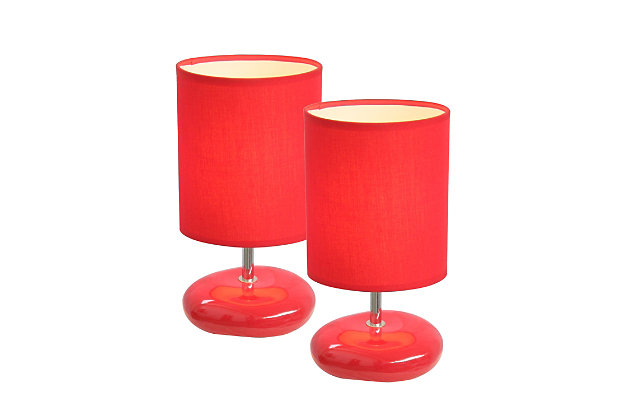 A fun, inexpensive, and practical table lamp set to meet your basic fashion lighting needs. These small lamps feature a stone shaped ceramic base and matching fabric shade. The compact size of these lamps make them the perfect bedside counterpart.2 x small stone shaped ceramic bases | 2 x matching fabric shades | Perfect for bedroom, kids room, or college dorm | Each measures: height: 10.24" shade diameter: 5.5"