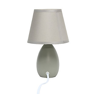 A lovely, inexpensive, and practical table lamp to meet your basic fashion lighting needs. This mini lamp features an oval shaped ceramic base and matching fabric shade. Perfect for living room, bedroom, office, kids room, or college dorm!Mini oval ceramic base | Matching fabric shade | Perfect for living room, bedroom, office, kids room, or college dorm | Height: 9.45" shade diameter: 5.5"