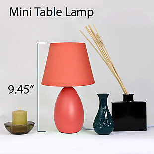 A lovely, inexpensive, and practical table lamp to meet your basic fashion lighting needs. This mini lamp features an oval shaped ceramic base and matching fabric shade. Perfect for living room, bedroom, office, kids room, or college dorm!Mini oval ceramic base | Matching fabric shade | Perfect for living room, bedroom, office, kids room, or college dorm | Height: 9.45" shade diameter: 5.5"