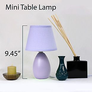 A lovely, inexpensive, and practical table lamp set to meet your basic fashion lighting needs. These mini lamps feature an oval shaped ceramic base and matching fabric shades. Perfect for living room, bedroom, office, kids room, or college dorm!2 x mini oval ceramic bases | 2 x matching fabric shades | Perfect for living room, bedroom, office, kids room, or college dorm | Each measures: height: 9.45" shade diameter: 5.5"