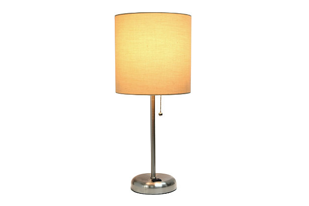 This fun and fashionable lamp features a brushed steel base and a tan fabric shade. It comes equipped with a 2 prong outlet seated in the base for use to charge mobile phones, handheld games, tablets, and other small electronics. This lamp will add a fabulous flair to any room. Perfect for bedrooms, kids and teens, college dorms, nurseries, or fun offices!Brushed steel base with charging outlet | Tan fabric shade | Perfect for bedrooms, kids room, college dorm, nursery, or fun office | Shade diameter: 8.27" x height: 19.29"