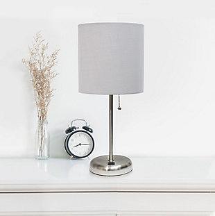 This fun and fashionable lamp features a brushed steel base and a fabric shade. It comes equipped with a USB seated in the base for use to charge mobile phones, handheld games, tablets, and other small electronics. This lamp will add a fabulous flair to any room. Perfect for bedrooms, kids and teens, college dorms, nurseries, or fun offices!Brushed steel base with usb charging port on base | Fabric shade | Perfect for bedrooms, kids room, college dorm, nursery, or fun office | Shade diameter: 8.5" x height: 19.5"