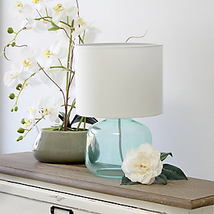 Illuminate your living space with this simple yet stylish glass table lamp.  The aqua glass jar shaped base and white fabric drum shade is the perfect blend  of charm to give your home a contemporary and modern upgrade.  Perfect for living rooms, bedrooms, kids and teens, college dorms, apartments, nurseries, or offices.Aqua glass base | White fabric drum shade | Easily accessible rotary switch located on the cord | Uses 1 x 40w medium type a base bulb (not included)