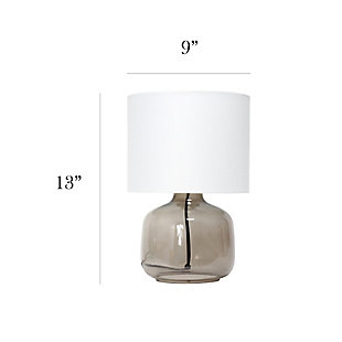 Illuminate your living space with this simple yet stylish glass table lamp.  The smoke gray glass jar shaped base and white fabric drum shade is the perfect blend  of charm to give your home a contemporary and modern upgrade.  Perfect for living rooms, bedrooms, kids and teens, college dorms, apartments, nurseries, or offices.Smoke gray glass base | White fabric drum shade | Easily accessible rotary switch located on the cord | Uses 1 x 40w medium type a base bulb (not included)