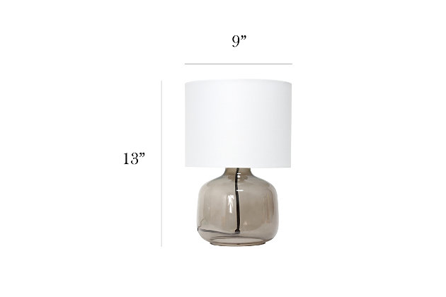 Illuminate your living space with this simple yet stylish glass table lamp.  The smoke gray glass jar shaped base and white fabric drum shade is the perfect blend  of charm to give your home a contemporary and modern upgrade.  Perfect for living rooms, bedrooms, kids and teens, college dorms, apartments, nurseries, or offices.Smoke gray glass base | White fabric drum shade | Easily accessible rotary switch located on the cord | Uses 1 x 40w medium type a base bulb (not included)