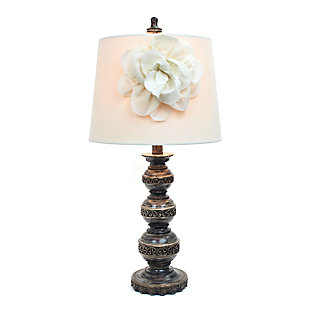 This aged bronze table lamp, with its three stacked ball base and linen shade with boutique flower adornment, will add style and pizzazz to any room. Perfect for living rooms, bedrooms, kids rooms, offices, or college dorms. We believe that lighting is like jewelry for your home. Our products will help to enhance your room with chic sophistication.3 ball stacked base with aged finish | Natural linen shade with flower adornment | Dimensions: lamp height: 25"  shade diameter: 12" | Uses 1 x 40w type a medium base bulb (not included)