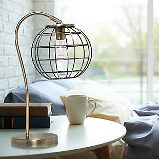 Illuminate your living space with this retro industrial table lamp!  It features a beautiful polished antique brass finish and an attractive round metal cage shade.  Standing 20 inches tall, it's the perfect piece to accent your office, bedroom, foyer or living room!

**HELPFUL TIP: To get the complete industrial look, we recommend using a decorative Edison/Vintage bulb (not included). **Round metal cage shade | Polished antique brass finish | 1 x 60w medium type a base bulb (not included) required | 5 foot black cord | Industrial style | Easily accessible on/off switch on cord