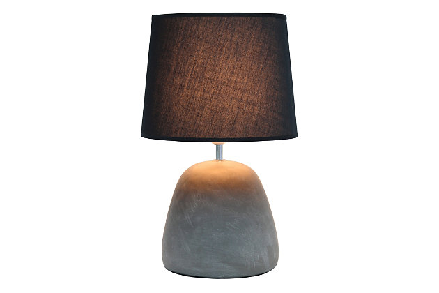 Simple yet stylish, this table lamp features a rounded gray concrete base complimented by a black fabric shade.  The perfect table lamp for an easy upgrade to give your home a sophisticated modern look!  Ideal for your living room, bedroom, office or entryway.Gray concrete base | Black fabric tapered shade | Easily accessible rotary switch on cord | Uses 1 x 60w medium type a base bulb (not included) | Lamp measures l: 10.25" x w: 10.25" x h:16.50" | Sophisticated & modern