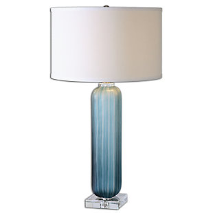 Put your decor in the best light possible with this table lamp. Its crudely grooved frosted blue glass is paired with polished nickel-plated accents and crystal details. A round hardback drum shade in crisp off-white linen fabric completes the lamp's striking look.Made of glass, metal, crystal and fabric | Glass base with frosted blue finish | Polished nickel-plated accents | Crystal details | Round hardback drum shade with off-white linen fabric | 3-way switch | Type a bulb; 150 watts max (not included)