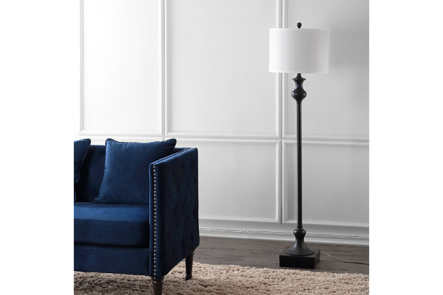 Relax and sit down for a spell. The Brewster floor lamp is ideal beside an armchair in any room in need of a warm glow and architectural detail. Its metal base, featuring an oil rubbed bronze-tone finish, boasts a weighty sculpted disposition balanced by a white drum shade.Oil rubbed bronze-tone finish on base | White drum shade | Plug-in floor lamp; light gray cord | Includes 1 bulb: LED, E26 A19, 9 watts | Assembly required