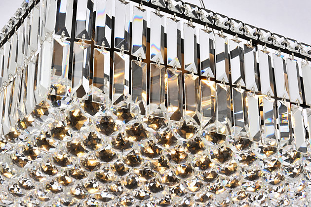 A riot of shapes and textures, Maxime collection hanging fixtures sparkle in a mosaic of crystal tiles. Square and rectangular precision-cut crystals form the flamboyant exterior while faceted crystal balls create a bubbled effect for light to shine through beneath. A mischievous asymmetrical hanging tube adds a touch of whimsy to this structured design. Available in a black or chrome finish with clear crystals, these lamps are a luxurious addition to a dining room, stairwell, foyer, or living room. Warm, brilliant light is created by 12 E12 light bulbs. (not included) | assembly is required | minimum hanging height of 14 inch and maximum hanging height of 80 inch | contrasting matte black frame finish complements the brilliant clear crystals | canopy size is 7.5 inch wide and 1 inch high | These exquisite gems will enrich the ambiance of any room, especially a kitchen, entryway, living room, or bathroom. | lighting is compatiable with LED bulbs and is dimmable; bulbs are not included