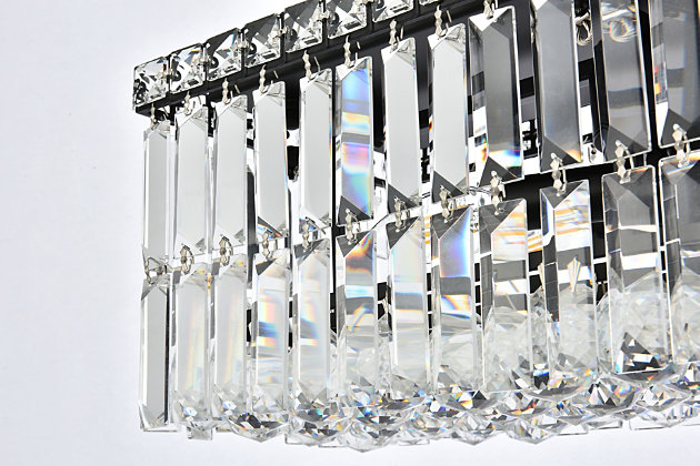 A riot of shapes and textures, Maxime collection flush mounts sparkle in a mosaic of crystal tiles. Square and rectangular precision-cut crystals form the flamboyant exterior while faceted crystal balls create a bubbled effect for light to shine through beneath. Available in a black or chrome finish with clear crystals, these lamps are a luxurious addition to a kitchen, stairwell, foyer, or living room. Warm, brilliant light is created by 4 E12 light bulbs. (not included) | Length of 20 inches, width of 10 inches, height of 7.5 inches | minimum hanging height of 14 inch and maximum hanging height of 80 inch | contrasting matte black frame finish complements the brilliant clear crystals | canopy size is 4.7 inch wide and 1 inch high | These exquisite gems will enrich the ambiance of any room, especially a kitchen, entryway, living room, or bathroom. | lighting is compatiable with LED bulbs and is dimmable; bulbs are not included