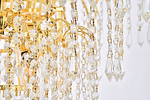 Bring the dazzling light of a cascading fountain into your home with a Falls hanging pendant. Overarching filaments of gold or chrome, resembling the shooting stream of a fountain, gradually transition into flowing strands of clear crystal octagons and prisms, simulating the movement of tumbling water. Descending tiers of crystals, in a variety of trims, refract the gleam of the frame and reinforce the feeling of a luminescent downpour that tapers into trickles of sparkling crystals. The Falls collection creates a soothing, calming ambiance anywhere these fixtures are placed. It is also an excellent way to complement a lanai or conservatory with a water fountain or greenery.Overarching gold filaments create the distinctive look of cascading water | Tiers of royal-cut clear crystals refract the gleaming frame | This pendant lamp features a diameter of 21 inches, a height of 18 inches, and 6 candelabra bulbs | comes with a 60 inch long hanging chain