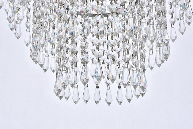 Bring the dazzling light of a cascading fountain into your home with a Falls hanging pendant. Overarching filaments of gold or chrome, resembling the shooting stream of a fountain, gradually transition into flowing strands of clear crystal octagons and prisms, simulating the movement of tumbling water. Descending tiers of crystals, in a variety of trims, refract the gleam of the frame and reinforce the feeling of a luminescent downpour that tapers into trickles of sparkling crystals. The Falls collection creates a soothing, calming ambiance anywhere these fixtures are placed. It is also an excellent way to complement a lanai or conservatory with a water fountain or greenery.Overarching chrome filaments create the distinctive look of cascading water | Tiers of royal-cut clear crystals refract the gleaming frame | This pendant lamp features a diameter of 25 inches, a height of 20 inches, and 6 candelabra bulbs | comes with a 60 inch long hanging chain