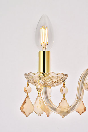 The 7804 Rococo collection was inspired by the lavish elegance of 18th century France, known for its graceful curves and light colors. The steel frame, available in an array of finishes, is highlighted by curved glass arms, a glass vase, and glass holders for the candelabra bulbs. Dangling from the delicately etched glass plates on three levels are royal-cut octagon and pendeloque crystals. It all comes together with a faceted glass sphere at the bottom. Optional shades of acrylic and organza add coziness to the glam. Petite in size yet grand in appearance, Rococo hanging pendants are perfect for enhancing the décor of smaller areas in your home.Steel frame with golden-teak finish is highlighted by curved glass arms, a glass vase, and glass holders for the 4 candelabra bulbs | Golden-teak (smoky) royal-cut octagon and pendeloque crystals dangle from three levels of delicately etched glass plates | Diameter of 15 inches, height of 12 inches | comes with a 60 inch long hanging chain
