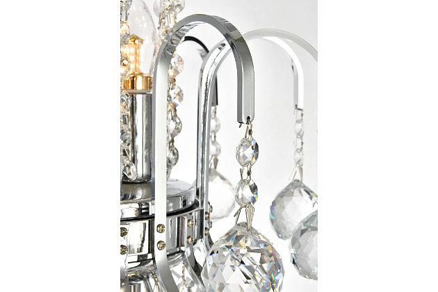 A treasure trove of glittering crystals, Toureg collection pendant lamps are generous with their sparkle. Stately curved steel arms and frame form an opulent flared shape available in chrome or gold finishes. Faceted clear crystal balls and crystal octagons offer a variety of options to choose from. Certain to be the center of attention in the dining room, living room, bedroom, or stairwell. Flared shape and curved steel arms, frame, and chain in a chrome finish  | Clear faceted crystal balls and royal-cut crystal octagons  | Lamp features a diameter of 22 inches, a height of 26 inches, and requires 11 candelabra bulbs  | comes with a 60 inch long hanging chain
