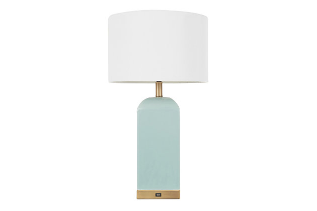 A versatile accent piece for your home, the Carmen Table Lamp by LumiSource is a color block beauty. Featuring a smooth ceramic base with a glossy finish complemented by brass accents, and white linen drum shade. Available in a variety of color options, the Carmen Table Lamp is perfect for any contemporary living space.Contemporary styling | White fabric shade | Ceramic base | Antique brass accents | Usb port