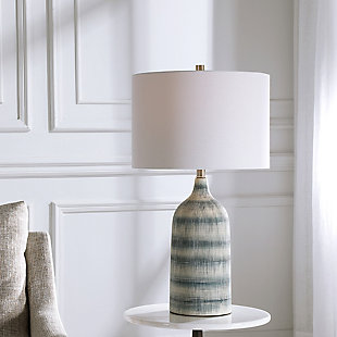 This casual, textured ceramic table lamp features a mixture of blue and white asymmetrical stripes, with brushed nickel-plated accents. The round hardback drum shade is a white linen fabric.Made with ceramic, metal and fabric | Uses one 150-watt bulb; sold separately