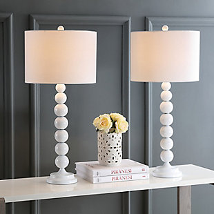Light up your life with the perfect symmetry of this gleaming white stacked ball lamp. The tall, lean silhouette adds height on a console or hall table, and the uniform color of the base, neck and finial are complemented by the off-white cotton drum shade. Set of 2 | Made with iron; 100% cotton shade  | Includes 2 CFL bulbs | 13W max | On/off switch  | 5' cord | Assembly required | Imported