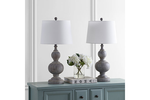 Inspired by nature’s beauty, this graceful table lamp instantly refreshes any living room. Designed with durable faux wood, the lamp features gentle curves and a weathered, elegant finish that pair perfectly with the matching finial and complementary cotton shade.Set of 2 | Made with resin and metal; 100% cotton shade | Each lamp includes 1 LED A19 9W bulb | Max. wattage: 100W (Type "A"), 23W (CFL), 12W (LED) | On/off switch | 5' cord | Assembly required | Imported